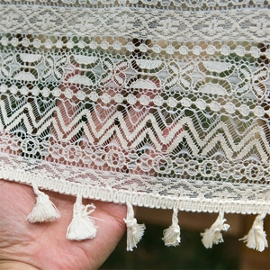 Beige lace tablecloth with vintage hollow patterns and tassel fringe details