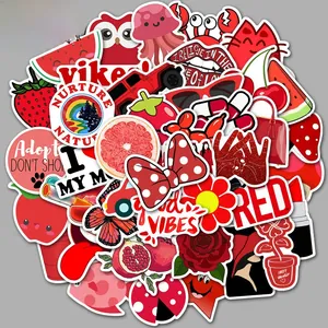 Close-up of assorted red aesthetic stickers featuring animal, fruit, and floral designs