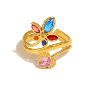 Macro shot of 18K gold leaf ring featuring colorful zircon flower and pink heart gemstone