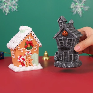 Miniature resin Christmas gingerbread house and Halloween ghost house festive decor pieces