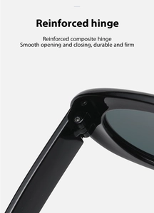 Detail view of reinforced composite hinges on black oval sunglasses for durability