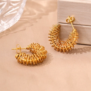 Golden stainless steel C-shaped earrings with industrial spiral wire wrap design