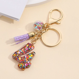 Resin number 4 keychain with colorful sequins, purple glitter tassel, and glass ball pendant