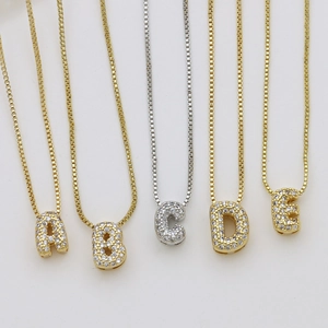 Gold and silver cubic zirconia bubble initial pendant necklaces with box chains