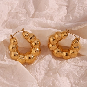 Close-up of polished 18K gold plated cloud bubble hollow hoop earrings for women