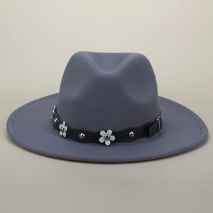 Detailed view of dark grey wool fedora with white floral studs and black wavy leather band
