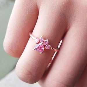 Adjustable rose gold cat paw ring with pink heart zircon worn on finger
