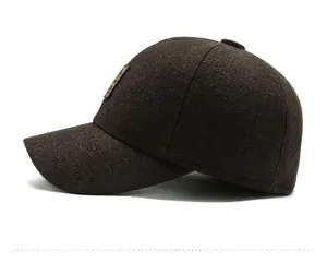 Detail of wool texture and vintage leather patch on men winter baseball cap