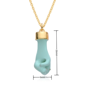 Detail view of light blue natural crystal fist pendant with 26mm by 9mm size dimensions