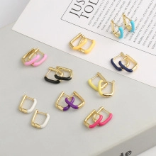 U-shaped gold-plated hoop earrings featuring multi-color enamel finishes in nine vibrant shades