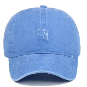 Close-up of cute dog embroidery on a vintage washed navy blue cotton baseball cap