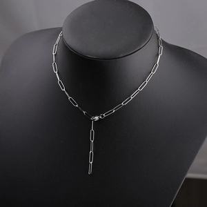 Detail of silver stainless steel paperclip chain necklace with adjustable extension links