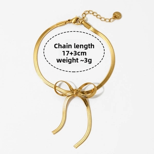 Detail of gold bow snake chain necklace showing length 17+3cm and 3g weight