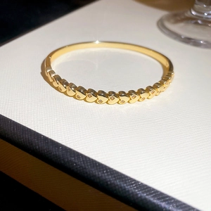 Detail shot of 18k gold plated heart-shaped link bracelet with sparkling zircon inlays