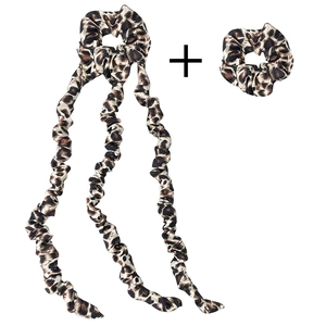 Detail view of two leopard print hair scrunchies in a satin combo set shown on white