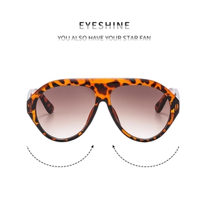 Close-up of oversized leopard print sunglasses with gradient brown lenses for women