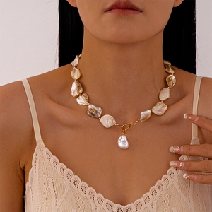 Baroque pearl pendant on shell bead necklace with gold OT buckle shown on neck