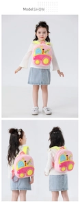 Detailed views showing a pink plush excavator backpack on a child from multiple angles