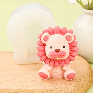 Detailed close-up of a silicone lion mold and a finished cartoon lion figurine on a base