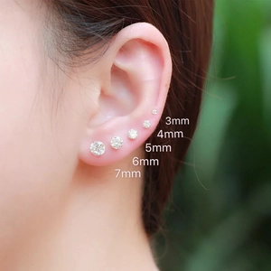 S999 sterling silver stud earrings with 3mm to 7mm zircon studs shown on ear
