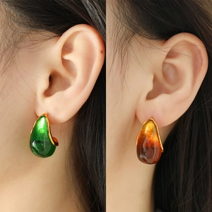 French vintage teardrop earrings in green and amber resin with 18K gold plated finish