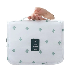 White waterproof travel organizer bag with green cactus print and sturdy top handle