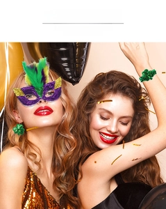 Detail of model wearing Mardi Gras sequin mask with feathers and clover earrings