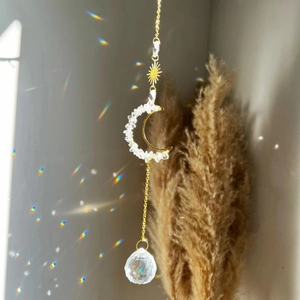 Golden sun and moon wind chime with amethyst stones and a clear crystal prism ball