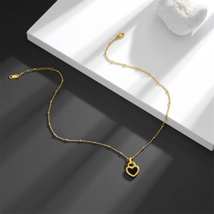 Golden titanium steel necklace with black heart shell pendant and delicate beaded chain design