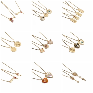 Collection of geometric gold plated necklaces with colorful enamel and zircon pendants