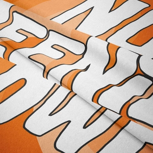 Close-up of soft velvet bohemian tapestry fabric with modern orange graphic patterns