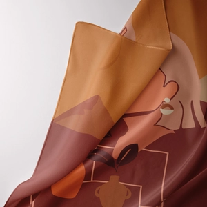 Macro shot of silk-like satin tapestry fabric with abstract bohemian earthy art details