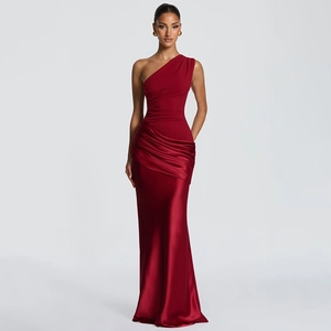 Detailed view of red one-shoulder satin evening dress featuring elegant pleated waist design