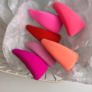 Set of six colorful sponge fabric BB hair clips in a white metal basket display