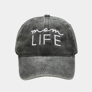 Detail of white mom LIFE embroidery on dark gray washed cotton baseball cap