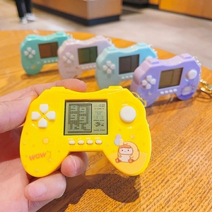 Mini retro handheld game console keychain in pastel colors with cute duck illustration