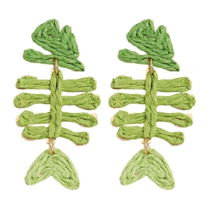 Macro detail of handmade green raffia fishbone earring with gold metallic base