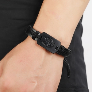 Men's punk leather bracelet featuring a black wolf head emblem and multilayer braided rope