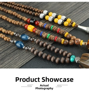 Detailed close-up of ethnic style wooden beaded necklaces with colorful gemstone accents