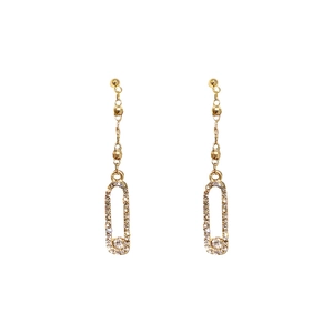 Long gold tassel earrings with rhinestone paved oval pendants on white background