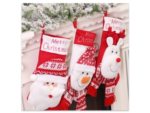 Three festive Christmas stockings with 3D Santa, Snowman and Reindeer on a fireplace