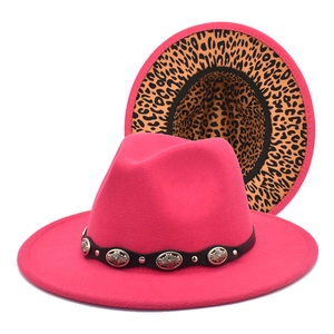Detail of hot pink wool fedora with leopard print brim and metal buckle strap