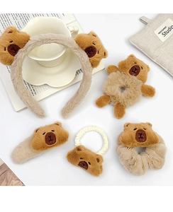 Detailed set of brown plush capybara hair accessories including headband and scrunchies