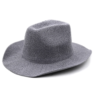 Detailed side view of a gray woven panama hat with a textured minimalist straw finish