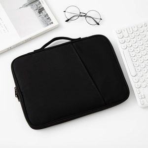 Slim black laptop sleeve case with durable handles and spacious front zipper pocket