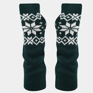 Detail of dark green knitted arm warmers with white snowflake patterns and ribbed cuffs