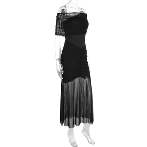 Detail of ruched black off-shoulder dress with sheer mesh skirt on mannequin
