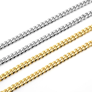 Detailed view of vacuum plated 18k gold and silver stainless steel Cuban link chains