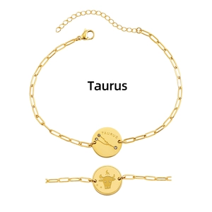 Detail view of Taurus zodiac constellation charm on a gold plated stainless steel chain bracelet