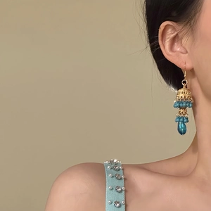 Vintage gold hollow bell earrings with turquoise beads and tassel, ethnic style for women